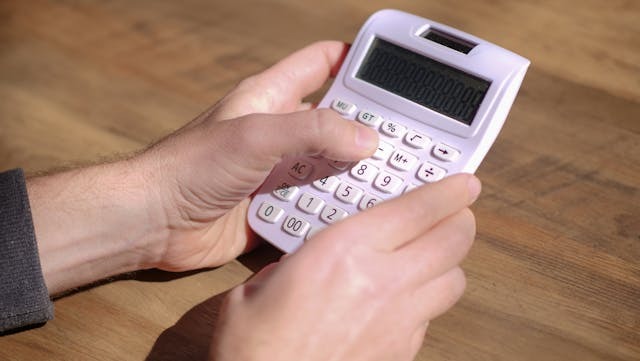 person using a clalculator