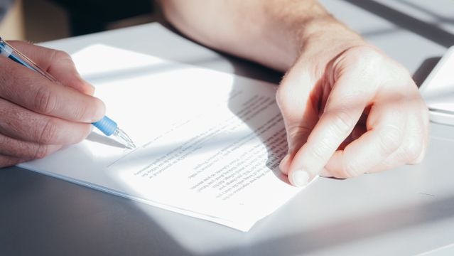 person reading over a document