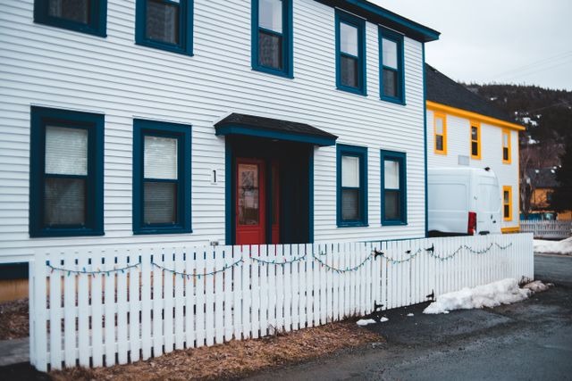 white fence infront of house