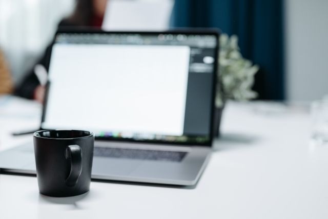 mug in front of computer