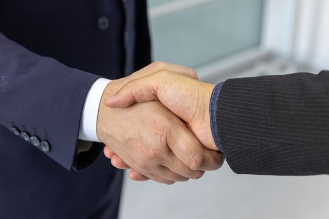 professional property manager shaking hands with property owner