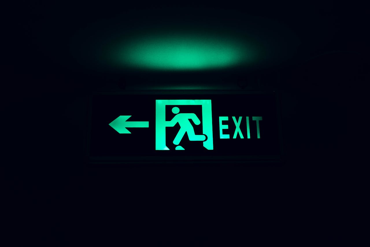 green emergency exit sign